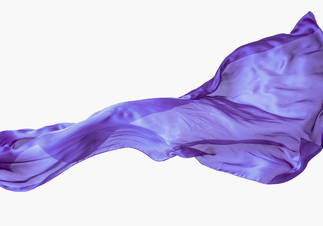 Smooth purple transparent cloth isolated on white background. Texture of flying fabric.
