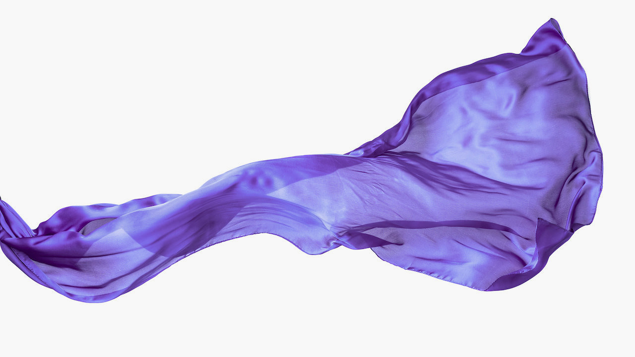 Smooth purple transparent cloth isolated on white background. Texture of flying fabric.